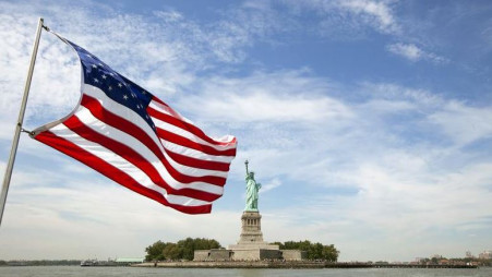 An American flag flutters in the wind on a boat near the Statue of Liberty in New York August 31, 2011. Reuters/Lucas Jackson