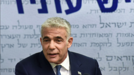 Yair Lapid, head of the centrist Yesh Atid party, delivers a statement to the press before the party faction meeting at the Knesset, Israel's parliament, in Jerusalem May 31, 2021. Debbie Hill/Pool via REUTERS