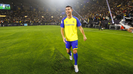 Cristiano Ronaldo holds Al Nassr no7 jersey after contract signed