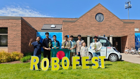 Members of the Bangladesh team pose with their trophies and national flag after securing third place in the Senior BottleSumo category at the Robofest 2026 World Championship in Michigan, United States. Photo: Courtesy