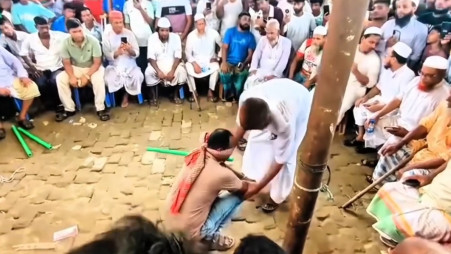 This screengrab from video footage shared online shows a man blindfolded and restrained before a crowd in Brahmanbaria's Nabinagar upazila on 4 June 2026. Photo: Collected 