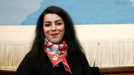 French-Iranian artist Marjane Satrapi poses in front of the Olympic tapestry in Paris, France, 12 March 2024. Photo: Reuters