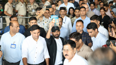 Abhijeet Dipke, head of the Cockroach Janta Party (CJP), gestures towards his supporters upon his arrival at an airport in New Delhi, India, June 6, 2026. REUTERS/Adnan Abidi 