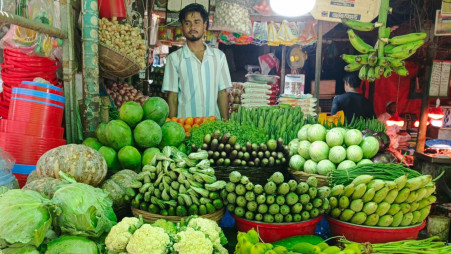A seller sells vegetables at a market in the capital amid stable prices following the proposed budget announcement. Photo: TBS