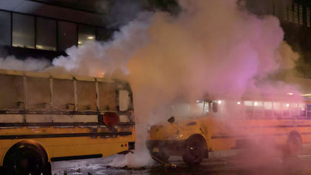 Firefighters extinguish a blaze on a shuttle bus used to transport spectators for the 2026 FIFA World Cup outside the Port Authority Bus Terminal in New York on 14 June 2026, amid celebrations following the New York Knicks' victory over the San Antonio Spurs and World Cup festivities. Photo: Reuters/Ed Ou