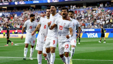 Iran's Ramin Rezaeian celebrates scoring their first goal with teammates. Photo: Reuters