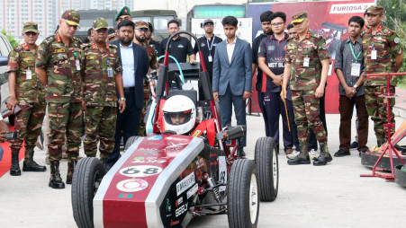 Army officials and participants inspect a Formula Student racing car at the inaugural Bangladesh Formula Student and Automotive Engineering Summit 2026 at MIST in Dhaka on 25 June. Photo: ISPR
