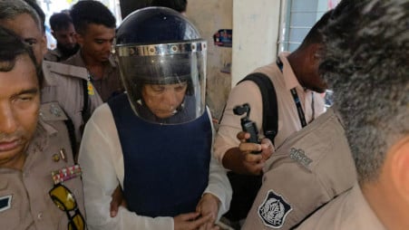 Former MP Md Afzal Hossain being escorted by police personnel on a Dhaka court premises on Monday, 6 July 2026. Photo: TBS 
