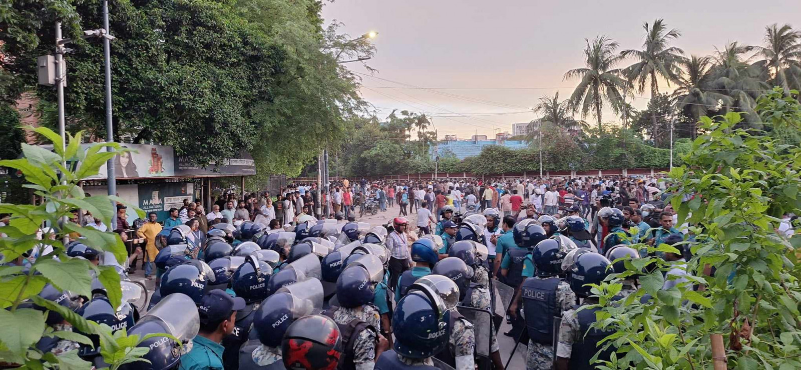 Policemen and BCL members at Doyel Chattar of DU. Photo: TBS/ Md Belal Hossen