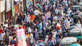 A vast number of people are ignoring health guidelines such as wearing masks and recommended physical distancing. At the city’s New Market, hawkers have occupied footpaths hardly leaving any room for pedestrians. Photo: UNB. 
