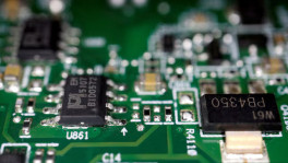 Semiconductor chips are seen on a printed circuit board in this illustration picture taken 17 February 2023. REUTERS/Florence Lo/Illustration/File Photo
