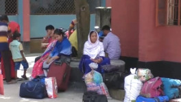 Photo shows some people sitting on Hili land port/UNB 
