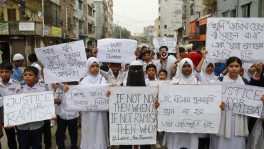 Teachers, students, and guardians demonstrated in the capital's Mirpur-11 today (21 May), demanding exemplary punishment for those responsible for the rape and murder of eight-year-old Ramisa Akter, a student of Popular Model High School in Pallabi. They brought out a procession from in front of the building where Ramisa’s family lives and marched through several roads in the area. Students participating in the rally were seen carrying placards reading “We Want Justice” and “Justice for Ramisa”.
Photo: TBS