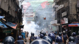 Protesters gather outside Islami Bank’s head office in Motijheel demanding the removal of the newly appointed chairman as police disperse them using water cannons, sound grenades, tear gas and baton charges. Photo: TBS