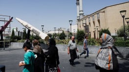 People walk next to a symbolic mock-up of an Iranian missile, on a street in Tehran, Iran, June 11, 2026. Photo: Majid Asgaripour/WANA (West Asia News Agency) via REUTERS