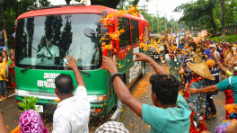 Tea garden workers welcome Prime Minister Tarique Rahman with flowers in the rain during his visit to Sylhet on 17 June 2026. Photo: TBS