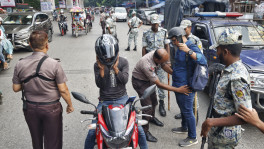 Police conduct security checks at a checkpoint in Dhaka’s Shahbagh area yesterday as authorities tightened security across key points in the capital ahead of the 77th founding anniversary of the banned Awami League. Photo: Rajib Dhar 

