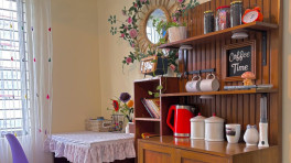 Decorative elements such as chalkboards, antique signs or woven baskets can reinforce the overall look of the corner. Photo: Decor by Bobby
