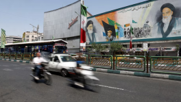 People ride past a mural depicting the late leader of the Islamic Revolution, Ayatollah Ruhollah Khomeini, and the late Iran's Supreme Leader Ayatollah Ali Khamenei, on a street in Tehran, Iran, June 3, 2026. Majid Asgaripour/WANA (West Asia News Agency) via REUTER