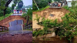 Locals inspect the collapsed section of a bridge on the Rangamati-Bandarban road in Rangunia, Chattogram, after heavy rain and hill runoff damaged the approach in the early hours of today. Photo: TBS