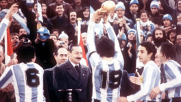 Here Videla is seen presenting the World Cup trophy to national football team captain Daniel Passarella after Argentina beat the Netherlands in the final on 25 June 1978. Photo: BBC


