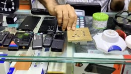A covert camera disguised as an electrical socket is sold openly at Dhaka market, along with other surveillance devices that are concealed inside everyday objects. Photos: TBS